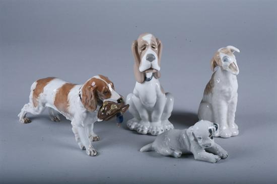 FOUR CONTINENTAL PORCELAIN FIGURES OF DOGS. - 7 1/2 in. high, largest.