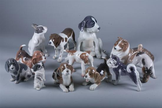 TWELVE ROYAL COPENHAGEN PORCELAIN FIGURES OF DOGS. - 8 in. high, largest.