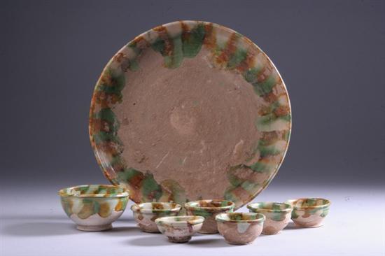CHINESE SANCAI DISH AND SEVEN BOWLS, Tang dynasty. - Largest: 10 in. diam.